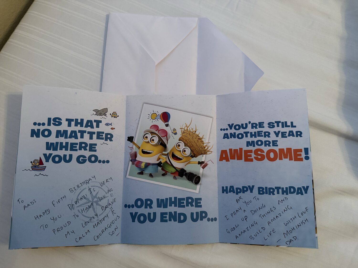 The opened birthday card showing Dad's handwritten fifth birthday message to Aadi on both inner panels.